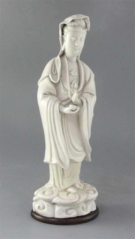 A large Chinese Dehua blanc de chine figure of Guanyin, Kangxi period, height 39cm, restored